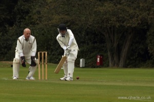 Phil Looks On As Carl Bats