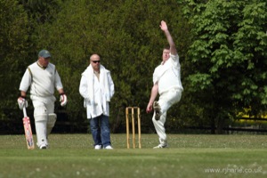 Ken Bowls as the Olivers Look On