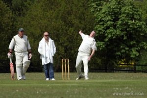 Ken Bowls as the Olivers Look On