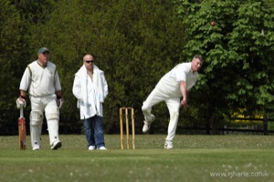 Ken Bowls as the Olivers Look On